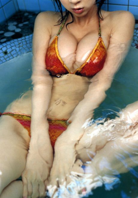 Hot, sultry asian gravure in a bikini with large yummy breasts