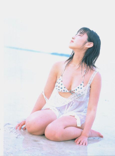 Voluptuous gravure idol in a bikini showing off her big boobs