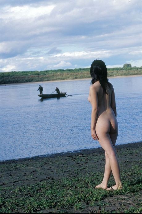 Asian amateur girl toying with a dildo in the outdoors