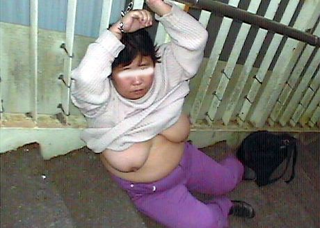 Asian schoolgirl with a big booty strips and shows her hairy cunt