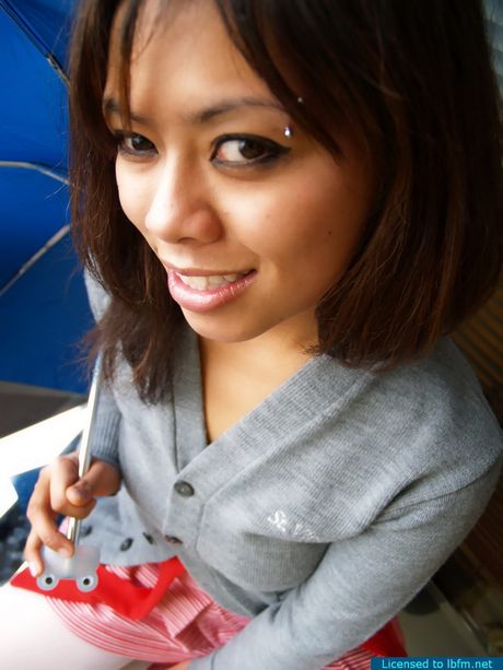 Busty broad flashing her shaved twat while playing with a teddy bear