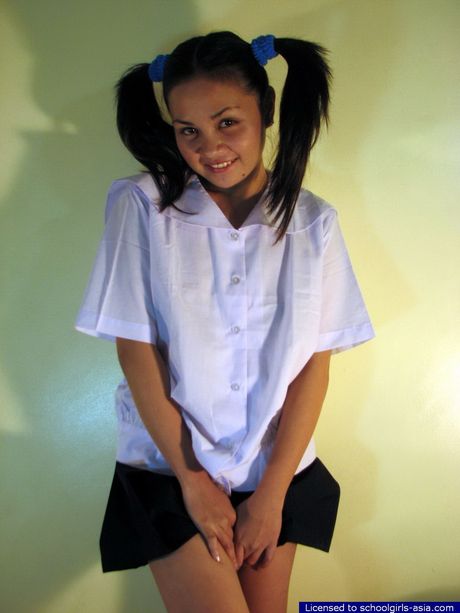 Her name is "Caresse" and she lifts her school skirt to earn some cash