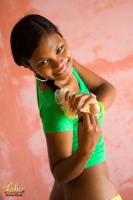 Foxy Indian teen shows brown tits and ass in boyshorts