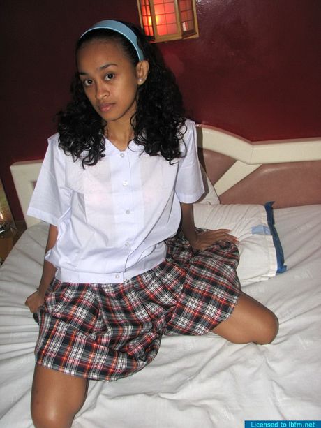 Sexy Asian teenager strips and shows her tiny tits and ass