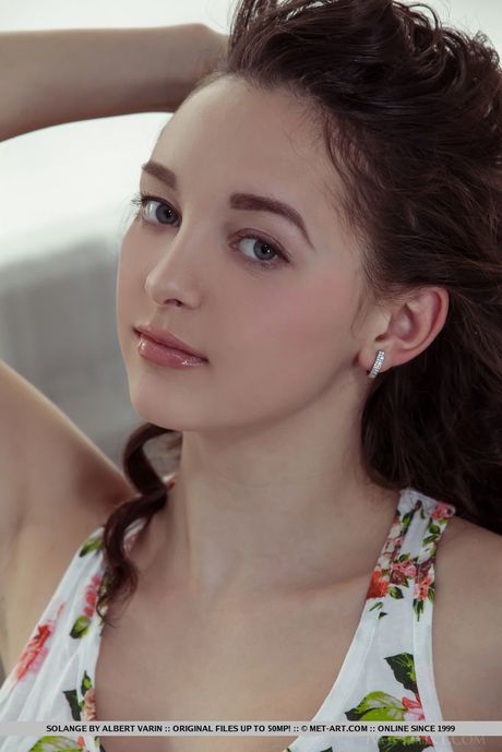 Teen Solange strips and shows her tiny tits and pink pussy