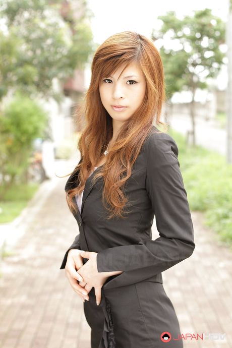 Stunning redhead office lady Rina Kikukawa posing outdoors with joy
