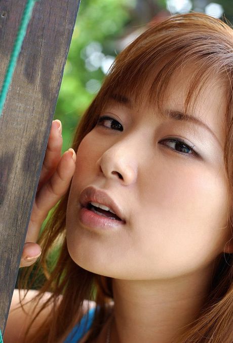 Platinum Japanese babe Yua Aida exhibits her tiny tits and hot ass poolside