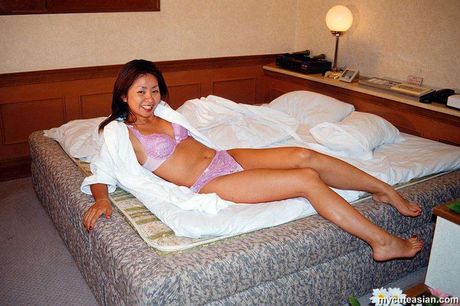 Stunning Asian wife with small tits and a sexy booty strips and reveals her naked form