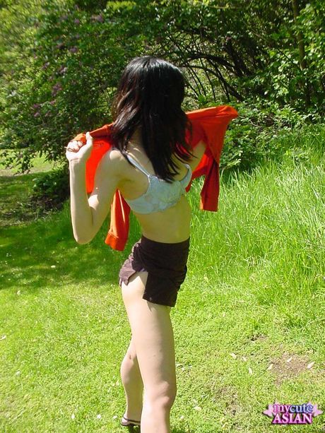 Platinum Japanese teen strips and shows her tiny tits and pussy